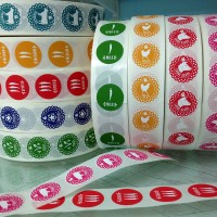 Small circle labels on rolls